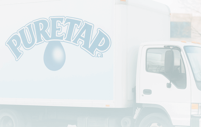 Puretap Water Distillers delivery truck in Mississauga, Ontario – locally bottled distilled and spring water for wholesale and pickup.