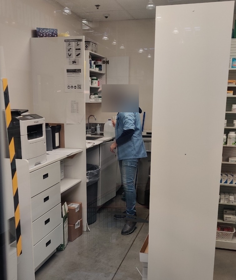 Pharmacist using Morning Mist distilled water in a pharmacy compounding and dispensing area