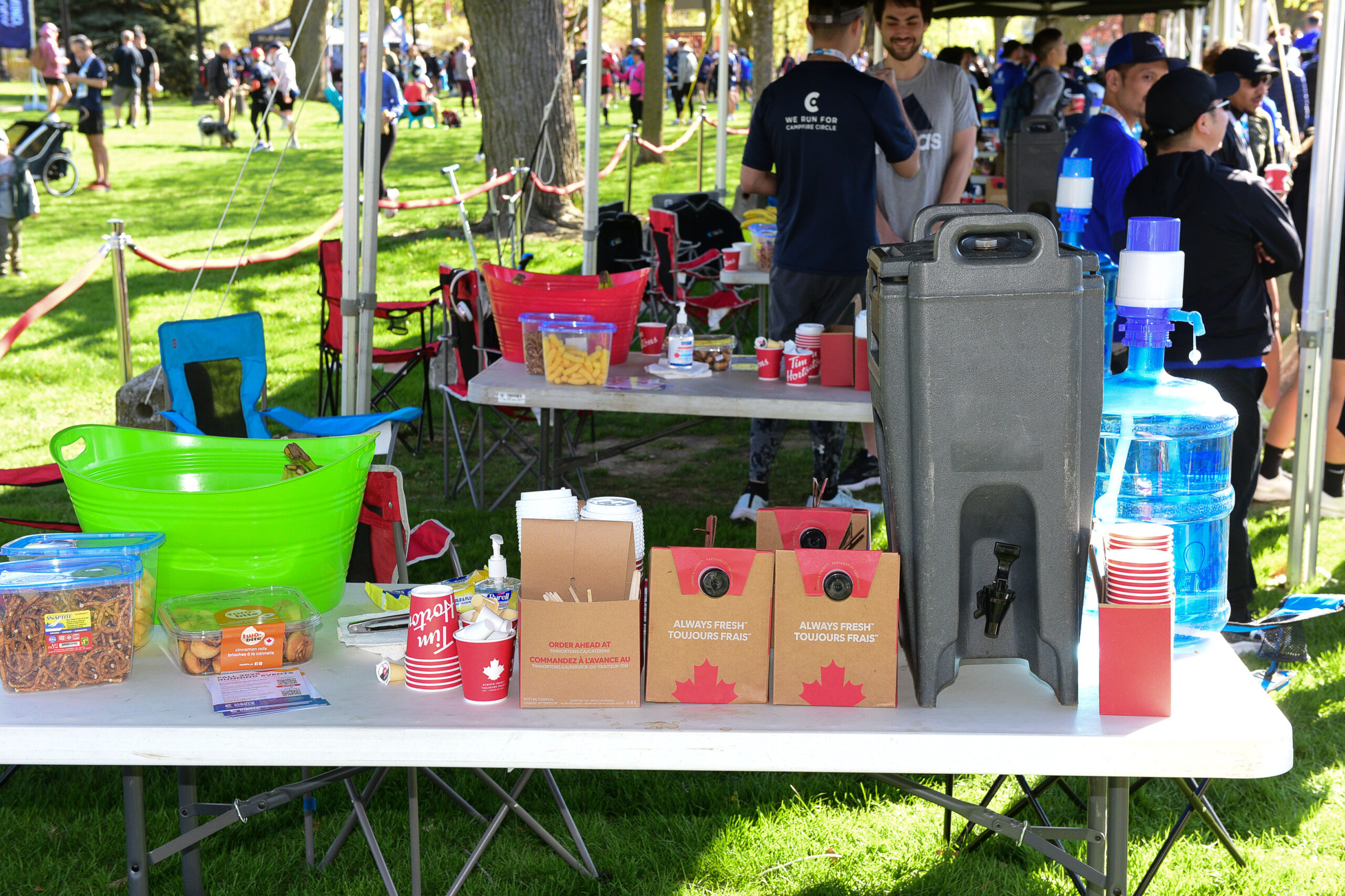 Atmosphere at the post-race party of the 2025 Sporting Life 10K in Toronto, with runners and supporters gathered after the race.